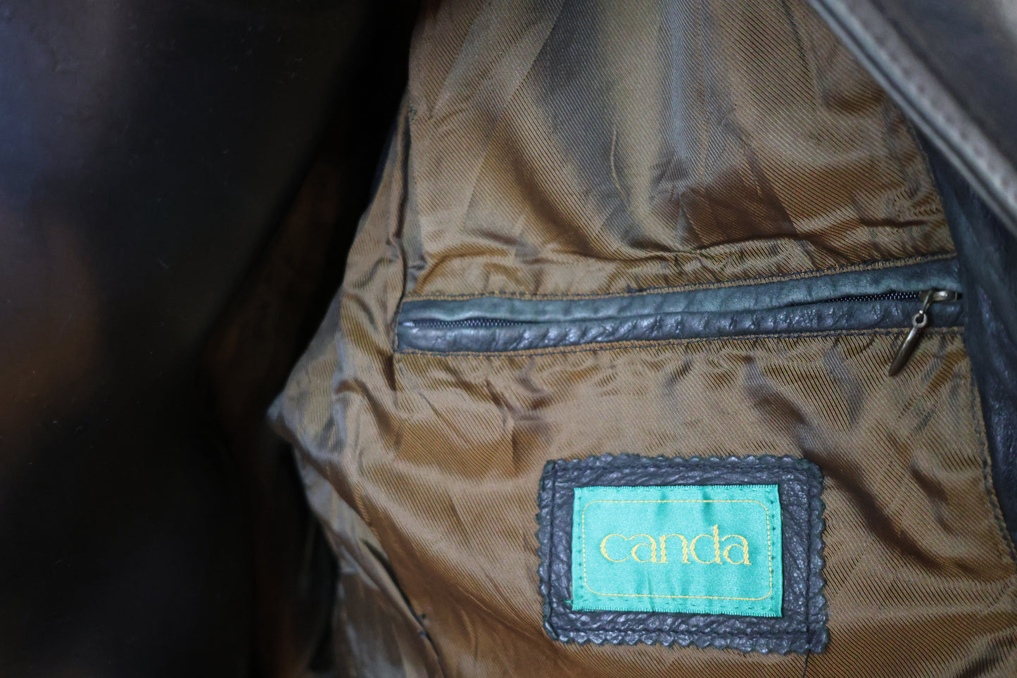 Washed out black leather bomber jacket