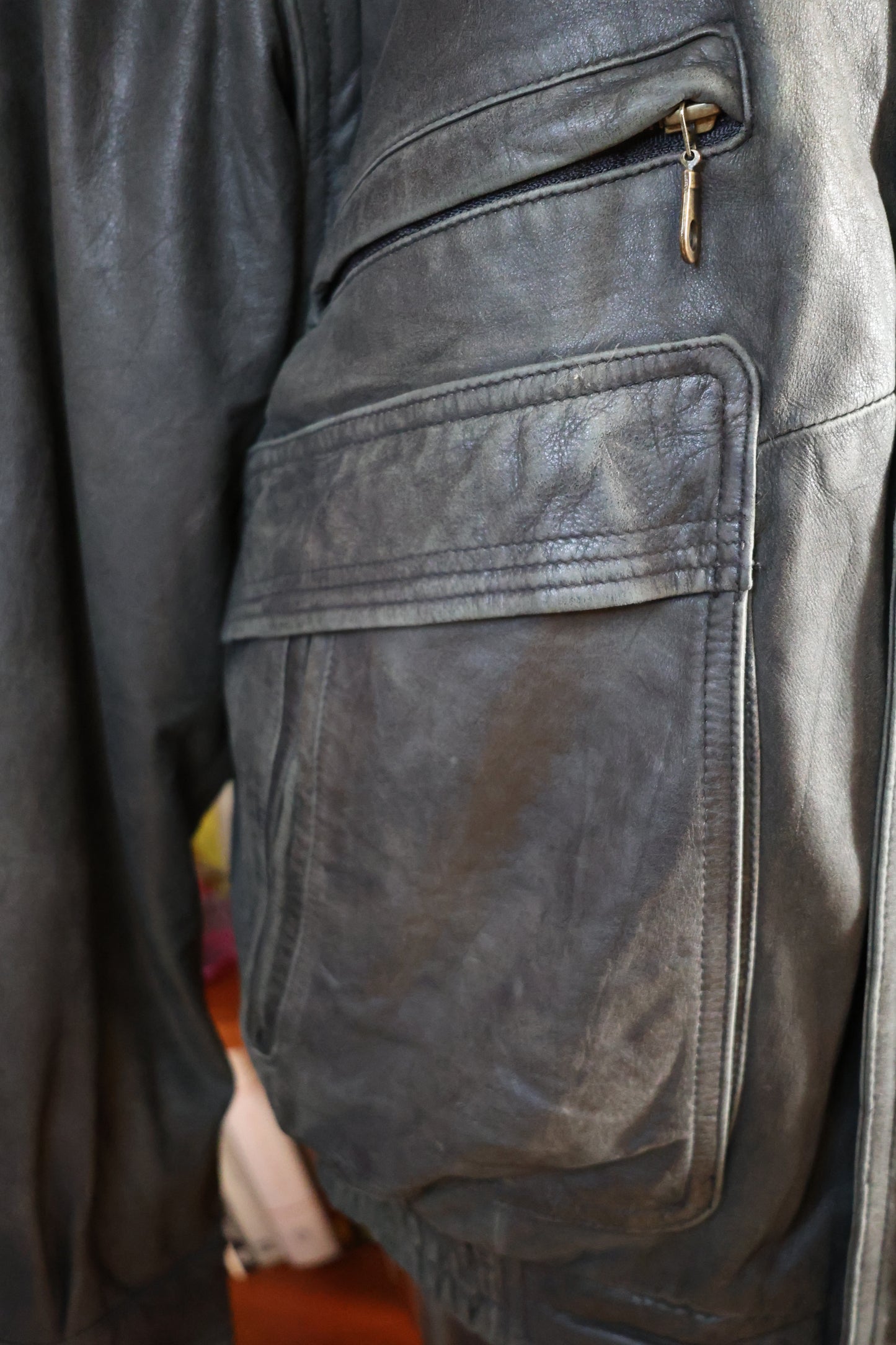 Washed out black leather bomber jacket