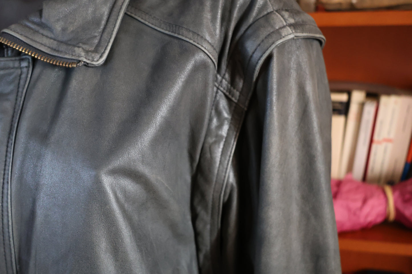 Washed out black leather bomber jacket